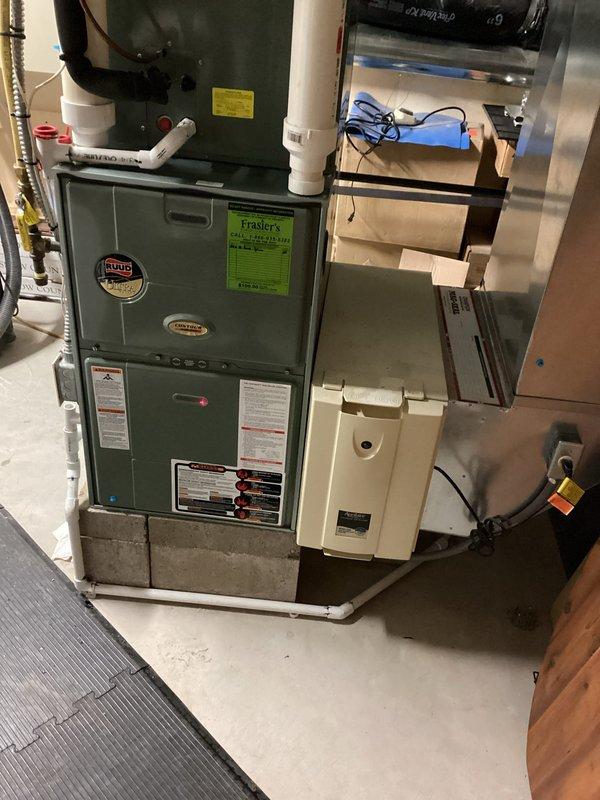 Replaced defective hard start kit at capacitor to restore proper compressor operation. Cleared and replaced clogged condensate drain line on furnace to ensure proper drainage and prevent water backup. System tested and confirmed operational upon completion.