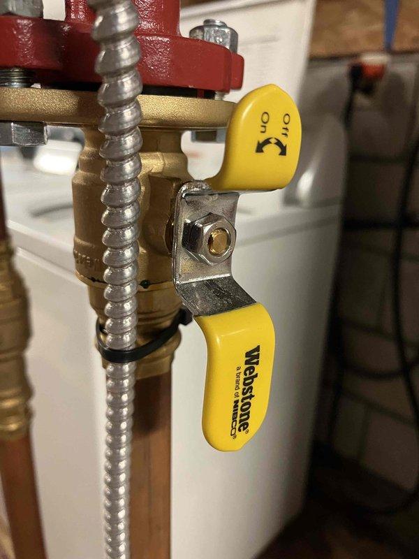 Responded to a boiler leak complaint and identified water seepage at the packing nuts of two ball valves in the system piping. Tightened both packing nuts to proper specification, cleaned up accumulated water from the affected area, and monitored the system to confirm leak resolution with no further seepage observed.