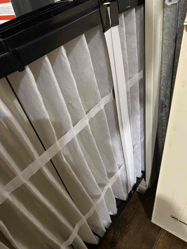 Responded to no cooling complaint and found tripped circuit breaker at electrical panel. Reset breaker to restore power to HVAC system and verified unit operation. Inspected air filter condition, which was found to be clean and properly installed.