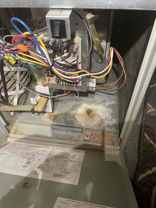 Responded to no cooling complaint on aging HVAC system of undetermined age. Upon inspection, found multiple operational concerns including deteriorated electrical components, visible rust and corrosion on interior base pan, and aging control systems. Documented existing conditions with photos showing worn wiring connections, discolored contactor assembly, and compromised cabinet integrity. Presented customer with comprehensive repair options to address immediate cooling failure along with full system replacement recommendation due to unit age and multiple compounding issues.