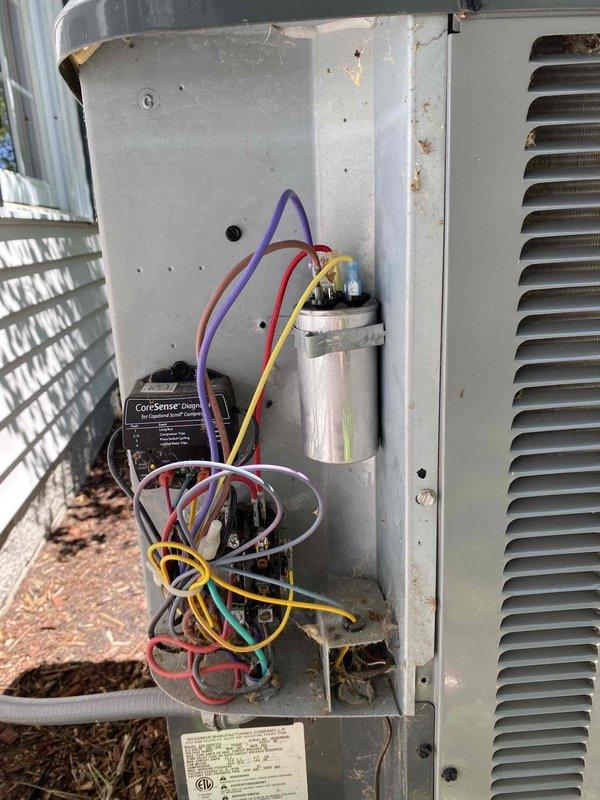 Responded to no cooling call on residential air conditioning system. Upon inspection, diagnosed failed dual run capacitor (40/5µF 440VAC) preventing compressor and condenser fan motor operation. Removed defective TONGFENG capacitor and installed new replacement unit, restoring proper system function. Verified all electrical connections, tested system operation, and confirmed adequate cooling performance before completing service call.