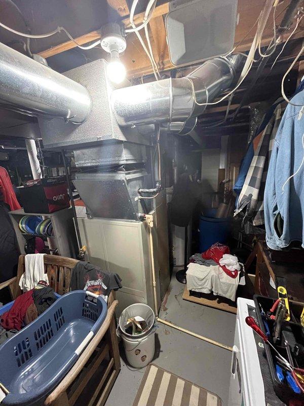 Responded to no cooling complaint on 10+ year old HVAC system. Upon inspection, found system completely empty of refrigerant and severely restricted airflow due to blocked filter. Replaced air filter to restore proper airflow and presented customer with repair options for addressing the refrigerant loss and system age.