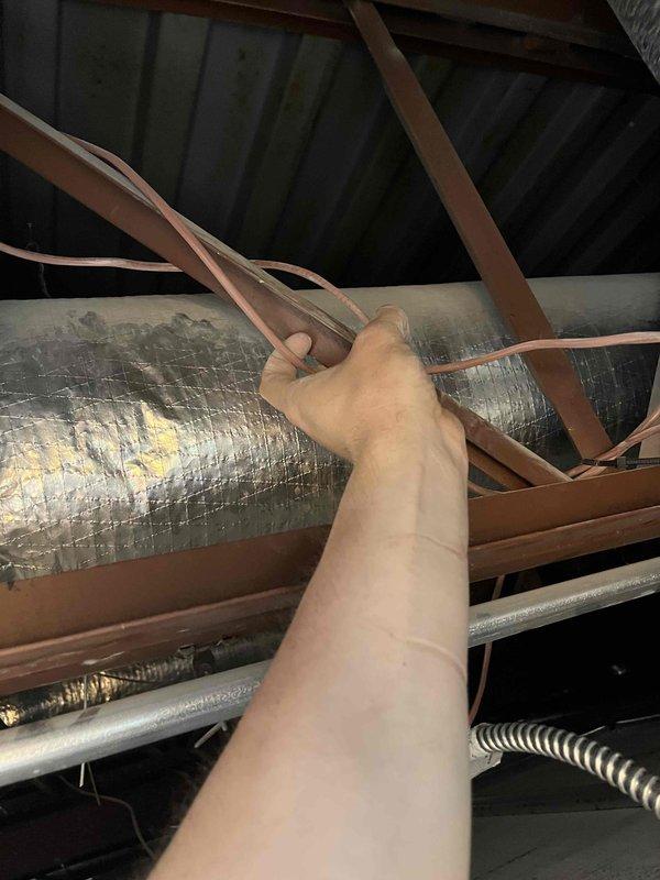 Responded to no cooling complaint in restaurant main lobby. Found RTU1 with melted contactor, replaced component but discovered compressor drawing 89 amps indicating failure; unit was shut down to prevent further damage. RTU2 had non-functioning Y wire at thermostat and rooftop unit; temporarily relocated W wire to Y terminal at both locations to restore cooling capability to lobby. Provided estimates for necessary repairs and left RTU1 offline pending approval.