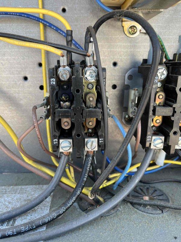 Responded to no cooling complaint in restaurant main lobby. Found RTU1 with melted contactor, replaced component but discovered compressor drawing 89 amps indicating failure; unit was shut down to prevent further damage. RTU2 had non-functioning Y wire at thermostat and rooftop unit; temporarily relocated W wire to Y terminal at both locations to restore cooling capability to lobby. Provided estimates for necessary repairs and left RTU1 offline pending approval.