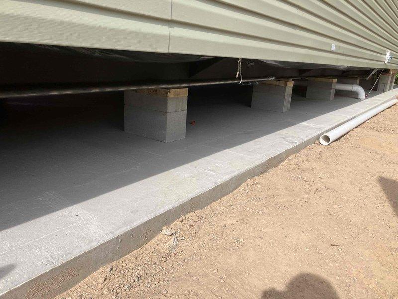 Provided estimate for gas piping installation requiring hard pipe run from interior to exterior of residence. Assessed crawl space access and existing foundation structure to determine routing for new gas line. Customer requested scheduling for installation following home setup completion.