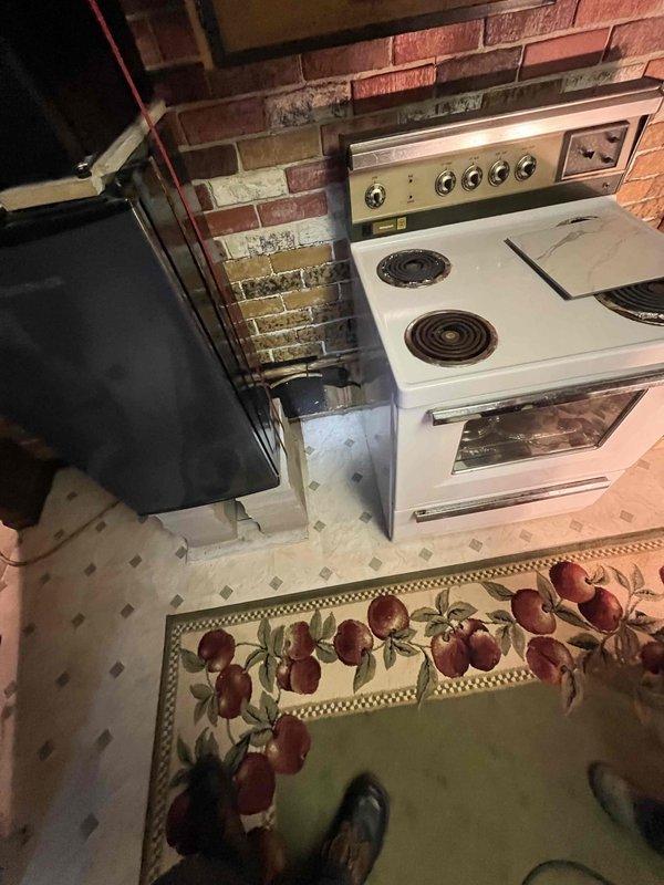 Responded to service call for gas line installation estimate to convert kitchen from electric to propane stove. Assessed existing conditions including outdoor gas connection point at brick exterior and current electric range location in kitchen. Determined approximately 16 feet of gas piping and appropriate shut-off valves would be required for safe installation. Clarified scope of work with customer, as there was initial misunderstanding regarding immediate installation versus estimate provision, and provided detailed written estimate for the gas line installation project.