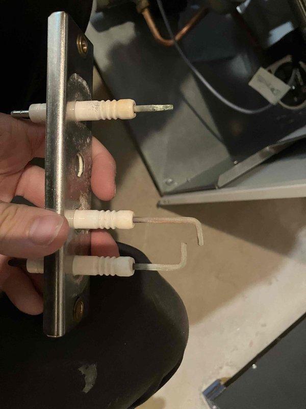 Completed annual heat inspection on furnace as part of prepaid maintenance plan. Identified leaking pressure relief valve on water heater and documented condition with photos showing corroded flame sensor assembly and igniter component with visible buildup. Provided estimates for necessary repairs to address the leaking relief valve.