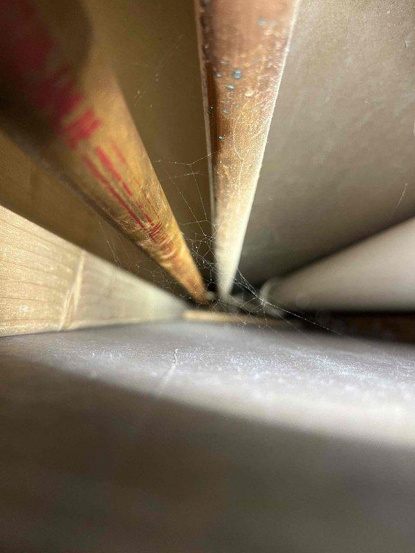 Responded to reported water leak in basement initially suspected to be from infloor heating system. Upon inspection, determined that moisture was not from HVAC equipment or infloor heat system, but rather from condensation forming on cold water supply lines due to elevated humidity levels in the space. Inspected exposed plumbing infrastructure, refrigerant lines, and ductwork in basement area to rule out any HVAC-related leaks or failures. Documented conditions with photos showing building systems, including PVC plumbing, copper refrigerant lines, and sheet metal ductwork. Advised customer that issue is related to humidity control rather than equipment malfunction. Provided estimate options for mini-split system installation to address comfort and humidity concerns.