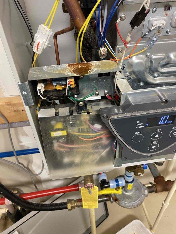Responded to no hot water call at wildlife rehabilitation facility with dual AO Smith tankless water heater system experiencing intermittent hot water issues. Upon inspection, both 3-year-old units were operational but displaying error codes. Diagnosed partially plugged inlet screen on right unit restricting water flow and causing intermittent performance. Removed and cleaned inlet screens on both tankless water heaters to ensure optimal flow rates. Cleared all error codes from system controllers to establish baseline for future diagnostic needs. Verified proper operation of both units with adequate hot water delivery upon completion.