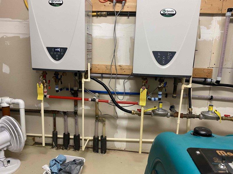 Responded to no hot water call at wildlife rehabilitation facility with dual AO Smith tankless water heater system experiencing intermittent hot water issues. Upon inspection, both 3-year-old units were operational but displaying error codes. Diagnosed partially plugged inlet screen on right unit restricting water flow and causing intermittent performance. Removed and cleaned inlet screens on both tankless water heaters to ensure optimal flow rates. Cleared all error codes from system controllers to establish baseline for future diagnostic needs. Verified proper operation of both units with adequate hot water delivery upon completion.