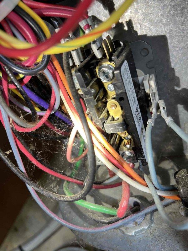 Completed annual partner plan inspection on 11-year-old AC system. Found capacitor reading below acceptable range and suction pressure levels off due to TXV valve malfunction affecting refrigerant flow. Documented electrical connections and wiring assembly with photos showing multiple wire terminals, contactor, and capacitor assembly. Provided estimates for necessary repairs to restore system to optimal operating condition.