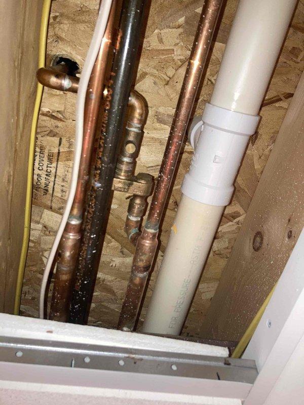 Completed prepaid annual maintenance on water heater system and inspected well pressure tank with associated plumbing connections. Addressed kitchen faucet leak that had developed since previous visit, performed necessary repairs, and verified proper operation of all plumbing fixtures and pressure regulation equipment.
