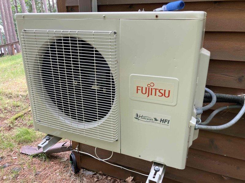 Completed annual preventative maintenance inspection on Fujitsu MicroTech HFI mini-split air conditioning system. Inspected outdoor condensing unit, checked refrigerant lines, and examined air filter which showed normal dirt accumulation from regular use. All components found to be operating within normal parameters with no deficiencies noted.