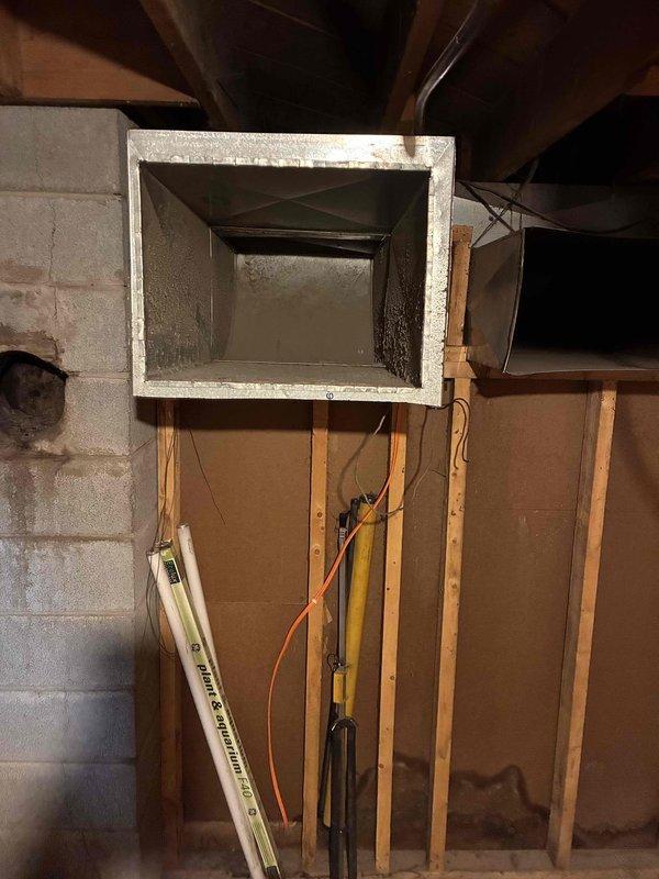 Completed duct cleaning estimate and assessment at residential property. Inspected main trunk line ductwork in unfinished basement area and crawl space, documenting existing HVAC system conditions including metal supply ducts and return air pathways. Evaluated furnace replacement options and provided recommendations for system upgrades based on current equipment age and performance capabilities.