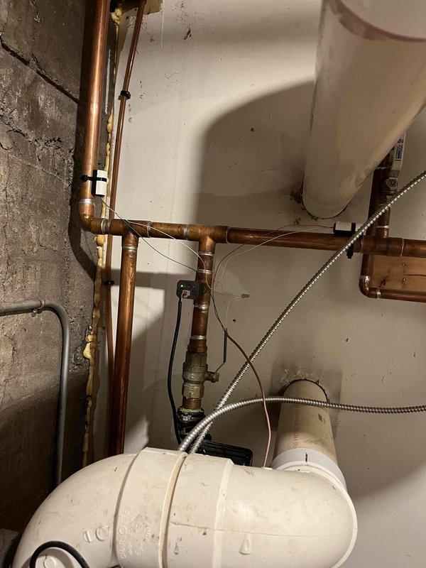 Responded to no hot water complaint on 1-year-old high efficiency combi boiler system. Diagnosed outdoor temperature sensor exceeding set limit, causing heating loop shutdown and preventing domestic hot water production. Investigation revealed improper initial installation where water heater was incorrectly tied into heating lines rather than dedicated DHW loop. Temporarily adjusted outdoor temp limit to 100°F to restore hot water functionality. Provided estimate for corrective replumbing to install water heater on dedicated zone 1 loop, which would allow proper DHW operation independent of outdoor temperature sensor per manufacturer specifications.
