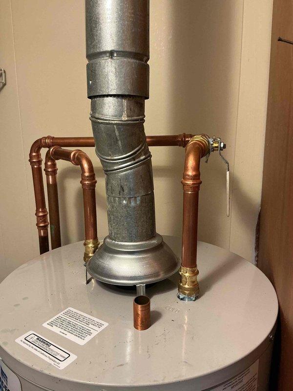 Completed installation of a new 30-gallon electric water heater with proper copper piping connections, temperature and pressure relief valve, and galvanized venting system. Additionally installed a new toilet and replaced a shower cartridge to restore full functionality to the bathroom plumbing fixtures.
