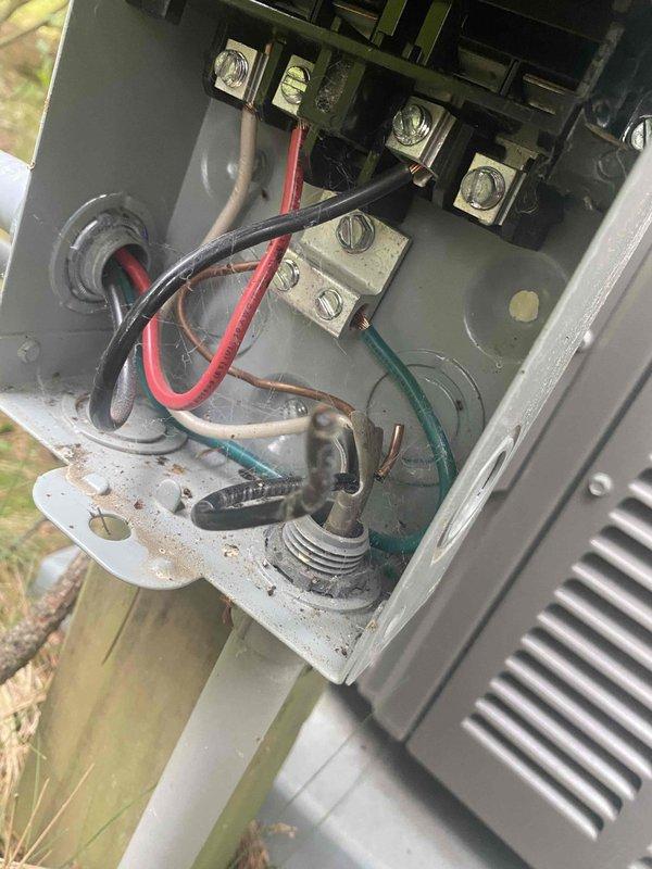 Responded to no cooling complaint on Lennox air conditioning system. Upon inspection, discovered broken wire in outdoor disconnect box causing condenser unit to remain off. Removed damaged wiring, installed new conductors, and properly terminated connections at disconnect terminals. Tested system operation; unit started successfully and returned to normal cooling function.