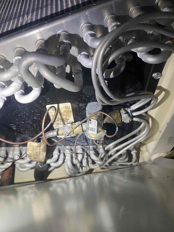 Responded to no cooling complaint on residential HVAC system over 12 years old. Upon diagnosis, found high pressure safety switch had tripped and thermostat was malfunctioning. Replaced faulty thermostat with new unit and reset high pressure switch. System restored to normal cooling operation. Also provided quote for air handler replacement due to age of equipment.