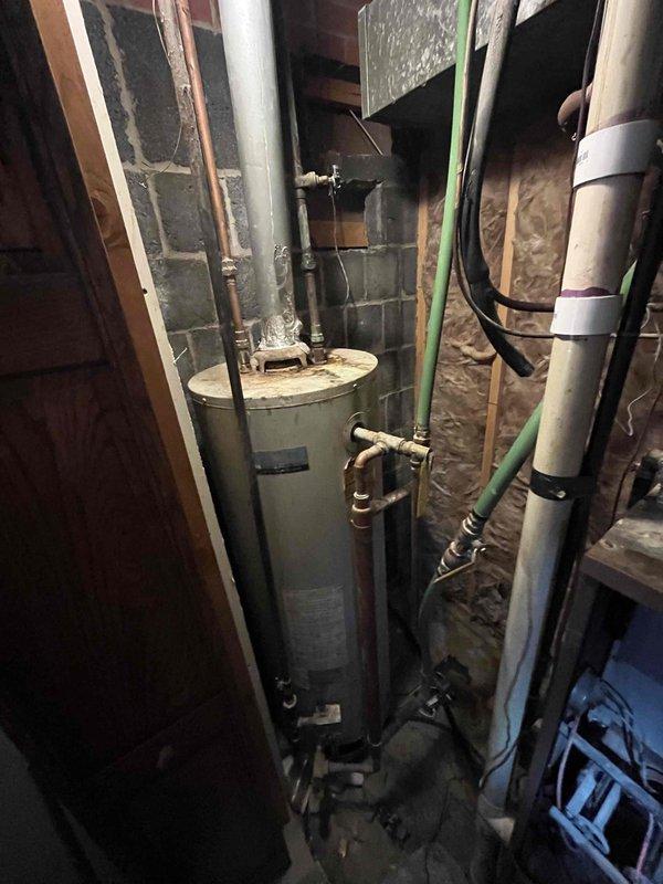 Responded to no cooling call on five-year-old air conditioning system. Diagnosed thermostat fan signal failure preventing system operation. Inspected control wiring at junction box in attic space and traced electrical connections to HVAC equipment in basement utility area. Provided estimate for thermostat replacement and necessary wiring repairs to restore proper system function.
