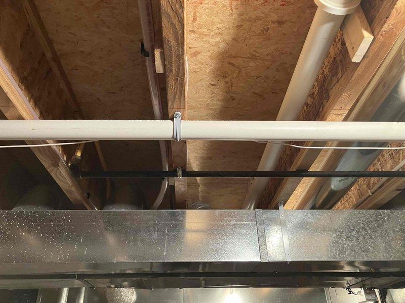 Responded to complaint of insufficient airflow to upstairs bedroom in home with 11-year-old air conditioning system. Upon inspection, identified improperly designed zone damper system and inadequate duct venting in attic space. Evaluated existing ductwork configuration and zoning controls, confirming poor air distribution throughout second floor. Recommended complete replacement of zoning system to resolve airflow deficiencies and improve comfort in affected areas.