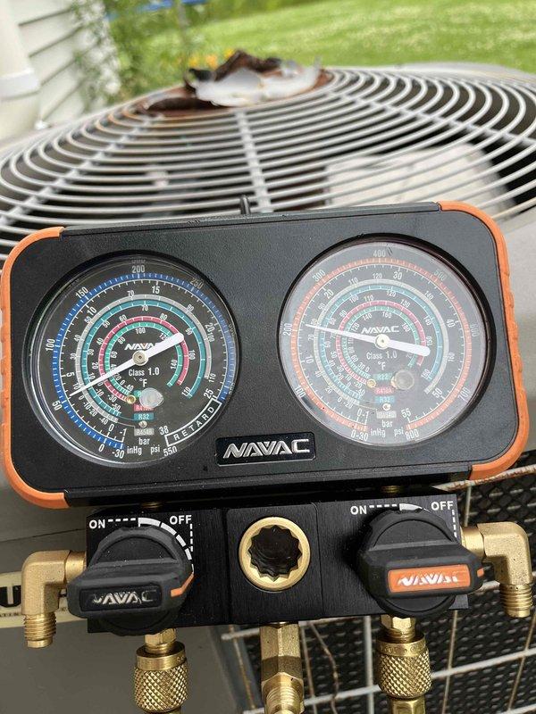 Responded to no cooling call on residential air conditioning system. Upon arrival, found outdoor condenser unit not engaging. Inspected control board and wiring connections, discovered control wiring disconnected from condenser relay preventing compressor operation. Reconnected control wiring and attempted system startup. Connected refrigerant gauge manifold to service ports and performed pressure check, revealing system severely undercharged indicating refrigerant leak. Performed nitrogen leak check procedure to identify leak location. Due to extent of refrigerant loss and required leak repair, recommended comfort advisor consultation for repair estimate and customer options.