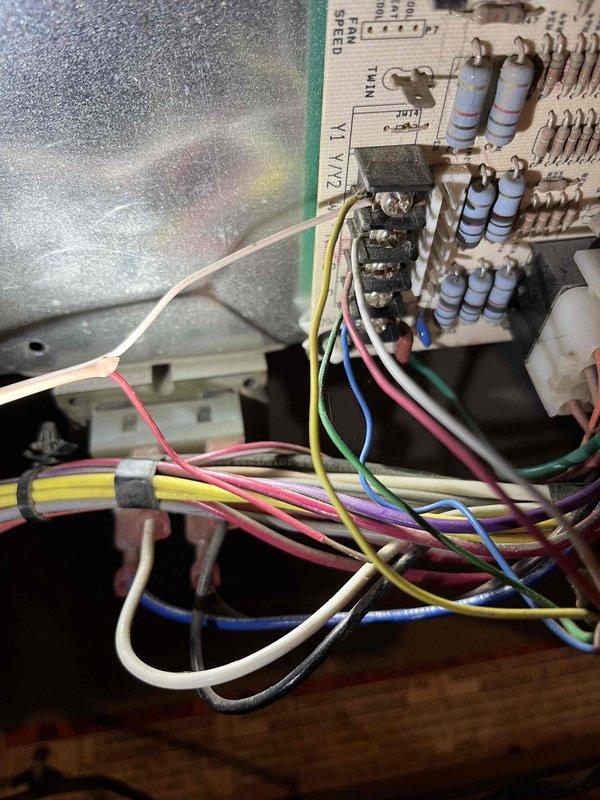 Responded to no cooling call on residential air conditioning system. Upon arrival, found outdoor condenser unit not engaging. Inspected control board and wiring connections, discovered control wiring disconnected from condenser relay preventing compressor operation. Reconnected control wiring and attempted system startup. Connected refrigerant gauge manifold to service ports and performed pressure check, revealing system severely undercharged indicating refrigerant leak. Performed nitrogen leak check procedure to identify leak location. Due to extent of refrigerant loss and required leak repair, recommended comfort advisor consultation for repair estimate and customer options.
