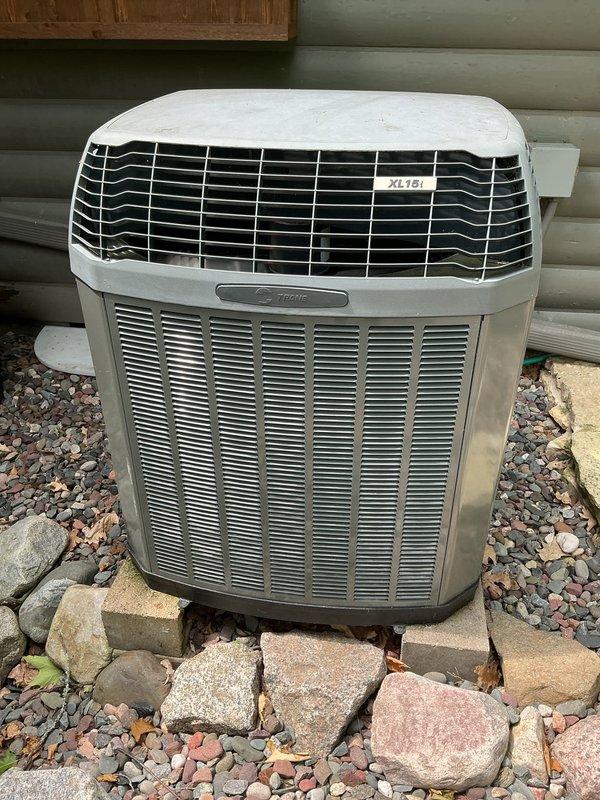 Responded to no cooling complaint on 16-year-old Trane XL15i heat pump system blowing warm air. Diagnosed failed defrost control board preventing proper cooling operation. Customer declined air handler work at this time. Replaced defective defrost board and restored system to normal cooling function.