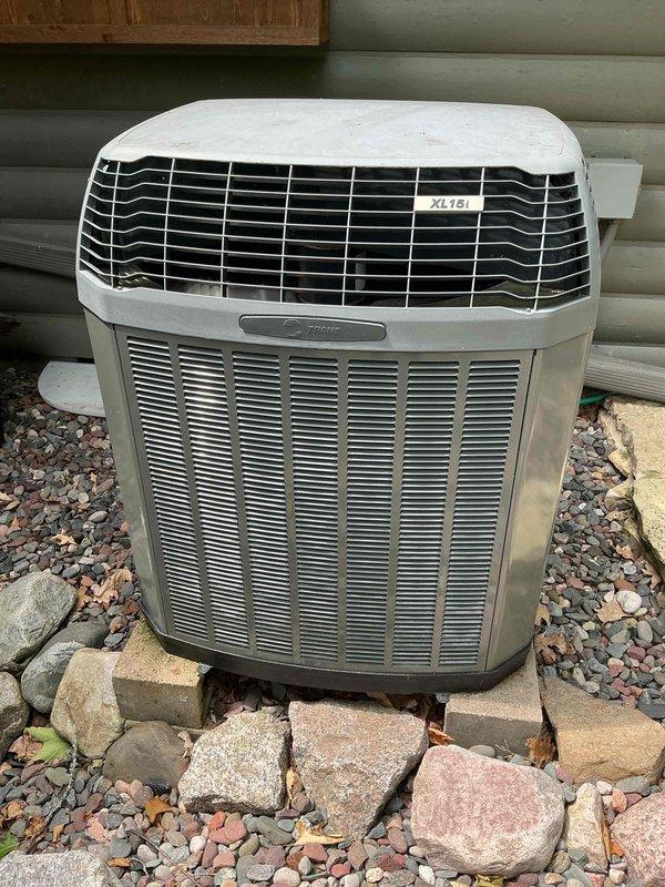 Responded to no cooling complaint on 16-year-old Trane XL15i heat pump system blowing warm air. Diagnosed failed defrost control board preventing proper cooling operation. Customer declined air handler work at this time. Replaced defective defrost board and restored system to normal cooling function.
