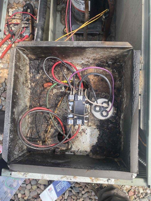 Responded to no cooling call on 18-year-old Rheem Classic air conditioning unit. Upon arrival, confirmed blower motor was operating but compressor failed to start. Diagnostic testing identified failed dual run capacitor and defective contactor as root cause of compressor failure. Replaced both capacitor and contactor with appropriate rated components. Verified proper electrical connections, tested system operation, and confirmed compressor startup and normal cooling cycle restoration. Unit returned to full operational status.