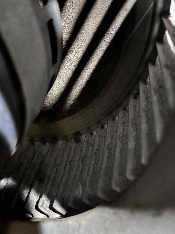 Performed complete duct cleaning service using professional duct cleaning equipment to remove accumulated dust and debris from all ductwork throughout the system. Removed and thoroughly cleaned the blower wheel assembly, which showed significant dust buildup on the squirrel cage fan blades and housing. Applied antimicrobial sanitizing spray throughout the ductwork system and allowed proper circulation to ensure complete coverage and improved indoor air quality.