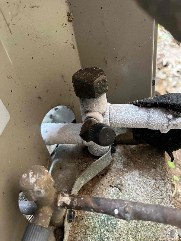 Responded to no cooling complaint on 12-year-old air conditioning system. Upon inspection, discovered low refrigerant levels in the unit. Performed visual inspection of refrigerant lines, noting significant corrosion and oxidation on copper piping, particularly at connection points and exterior-mounted components. The advanced deterioration of the refrigerant lines suggests potential leak points requiring further diagnostic testing. Recommended comprehensive leak test to identify exact location of refrigerant loss and provided comfort advisor consultation option for system replacement consideration given the age and condition of the equipment.