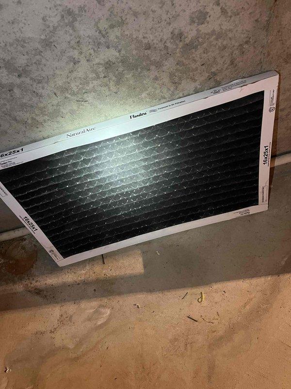 Responded to service call for AC leak and clogged furnace tubing. Found severely restricted airflow due to extremely dirty air filter, which caused evaporator coil to freeze and subsequently leak upon thawing. Cleared blockage from condensate drain line and replaced air filter with customer-supplied unit to restore proper system operation.