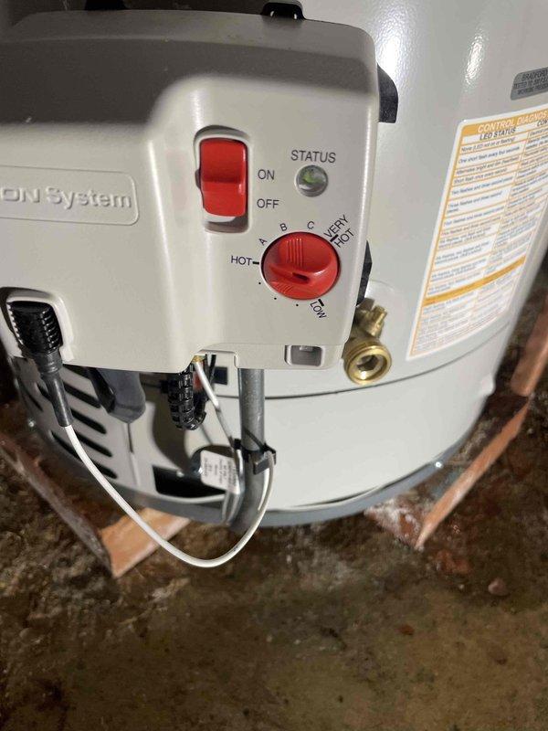 Responded to no hot water complaint on 16-year-old residential water heater displaying ignition failure code. Upon inspection, unit was found in vacation mode and exhibited signs of age-related failure beyond economical repair. Removed and properly disposed of existing tanked water heater. Installed new Bradford White tanked water heater in basement utility area, connecting to existing copper supply and discharge lines. Verified all plumbing connections for proper seal, tested temperature and pressure relief valve operation, and programmed control settings. Unit tested and confirmed operational with proper hot water delivery throughout residence.