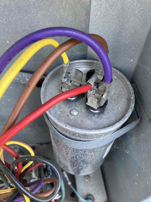 Responded to no cooling complaint at group home facility. Upon inspection, discovered broken wiring at the outdoor condensing unit causing system failure. Replaced damaged wiring connections to capacitor and contactor, secured all electrical connections, and restored proper wire routing. Tested system operation and confirmed unit cooling properly before departure.