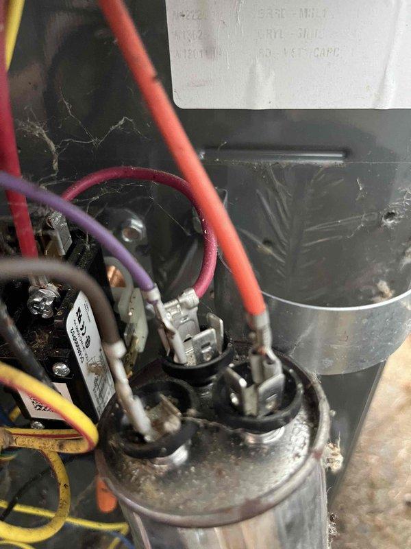 Responded to no cooling call on approximately 15-year-old HVAC system. Upon inspection, found failed dual-run capacitor on outdoor condensing unit, preventing compressor operation. Unit interior showed significant dust and debris accumulation consistent with age and lack of maintenance. Replaced defective capacitor and restored system to normal cooling operation.