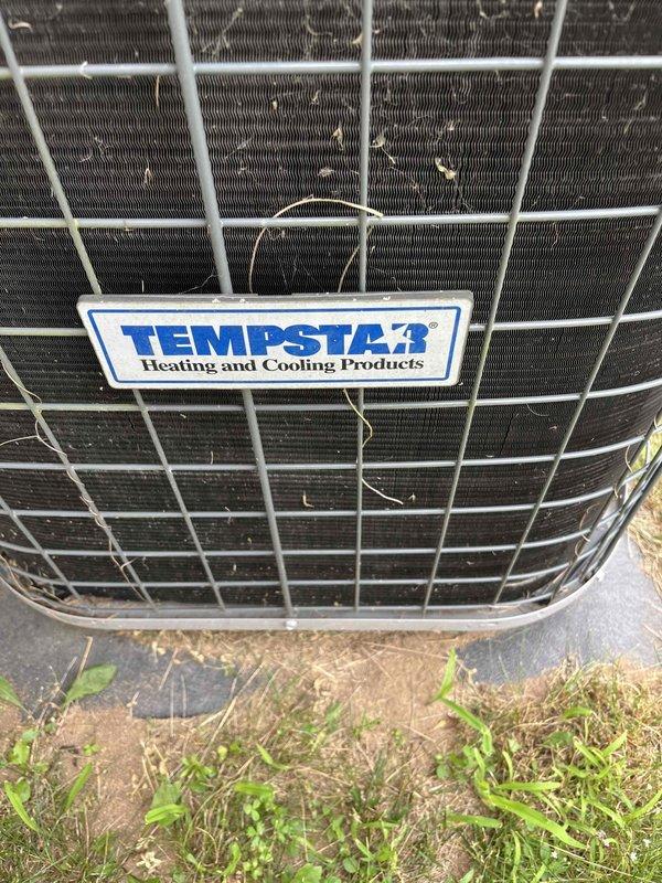 Responded to no cooling complaint on 11-year-old Tempstar air conditioning system. Upon arrival, confirmed compressor was not operating. Diagnosed and replaced failed capacitor in condenser unit, restoring compressor operation. Performed system performance evaluation and discovered subcool reading of 4-5 degrees and declining. Measured suction and discharge pressures, both reading below manufacturer specifications. Inspected blower wheel, evaporator coil, and air filter for blockages—all clear. Low subcool and below-specification operating pressures indicate refrigerant leak in system. Capacitor replacement completed successfully. Provided customer with repair options to address refrigerant leak issue. System currently operational but requires refrigerant leak repair for proper cooling performance.