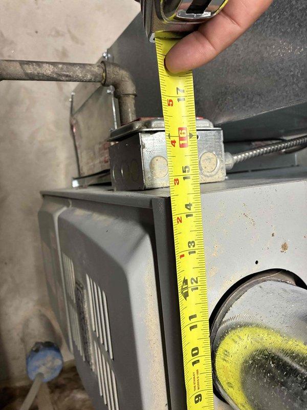 Responded to service call for AC reconnection following construction work. Upon arrival, assessed 8-year-old air conditioning system with R-410A refrigerant that had been previously disconnected. Performed thorough inspection of existing equipment and measured clearances for proper reconnection. Evaluated condition of indoor air handler unit, noting visible age-related wear and rust staining on cabinet. Determined that existing line set and A-coil would require replacement to properly reconnect system to current code standards. Unable to confirm whether refrigerant was properly reclaimed during initial disconnection. Provided detailed estimate for reconnection of current unit including new line set installation, A-coil replacement, and refrigerant charging. Additionally provided estimate for complete system replacement with new equipment as an alternative option. Documented equipment condition and measurements with photos for estimate records.