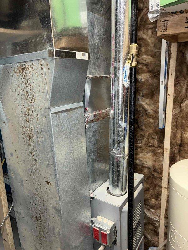 Responded to service call for AC reconnection following construction work. Upon arrival, assessed 8-year-old air conditioning system with R-410A refrigerant that had been previously disconnected. Performed thorough inspection of existing equipment and measured clearances for proper reconnection. Evaluated condition of indoor air handler unit, noting visible age-related wear and rust staining on cabinet. Determined that existing line set and A-coil would require replacement to properly reconnect system to current code standards. Unable to confirm whether refrigerant was properly reclaimed during initial disconnection. Provided detailed estimate for reconnection of current unit including new line set installation, A-coil replacement, and refrigerant charging. Additionally provided estimate for complete system replacement with new equipment as an alternative option. Documented equipment condition and measurements with photos for estimate records.