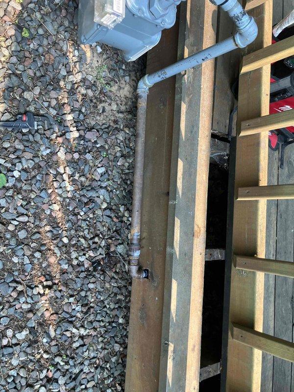 Identified severely corroded gas piping at exterior foundation requiring immediate replacement due to safety concerns. Sold and scheduled gas piping replacement work to address the hazardous condition and ensure proper system integrity.