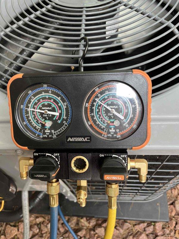Responded to service call for two AC units with reported cooling issues and water leakage on lower level. Inspected upper level system and identified water leak caused by loose drain pan fitting, condensation buildup on exposed suction line, and restricted airflow from dirty air filter. Secured drain pan fitting, replaced air filter, and addressed condensation issue to restore proper operation. Checked refrigerant pressures on outdoor condensing unit to verify system performance. Provided estimate for relocating lineset to prevent future condensation concerns per homeowner's request.