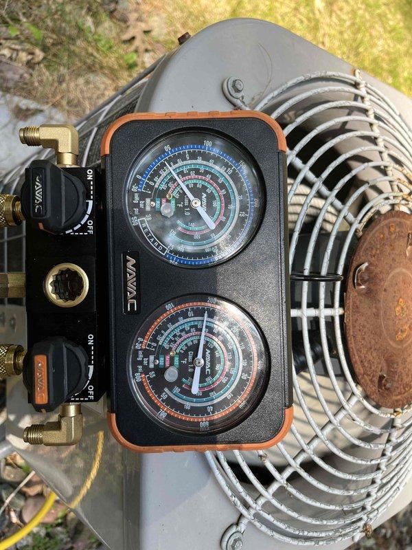 Responded to no cooling complaint on 20+ year old R22 system with water leaking from evaporator coil. Found system pressure dangerously low, causing evaporator to freeze within minutes of operation. Performed pressure check using manifold gauges, confirmed significant refrigerant loss and active leak at evaporator. Conducted leak check and documented system condition with photos. Due to age of equipment, obsolete R22 refrigerant, and extent of repairs needed, recommended comfort advisor consultation for system replacement options, which customer accepted for same-day evaluation.