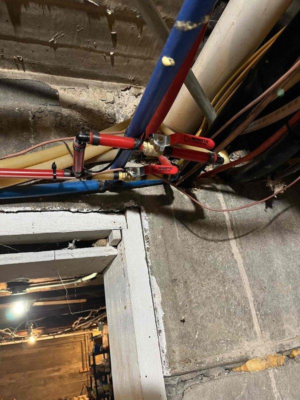 Responded to complaint of heat coming through hot water registers when boiler was off. Removed outdoor temperature sensor from Evergreen circuit loop and adjusted system settings to resolve the issue. System tested and confirmed operating normally after sensor removal. Additionally inspected noisy circulating pump on secondary boiler, identified as a small black Gould pump serving the domestic hot water system. Prepared estimate for pump replacement as unit is not a stock item.