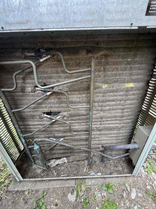 Responded to no cool call on approximately 30-year-old HVAC system. Upon inspection, found failed capacitor and severely plugged condenser coil with heavy dust and debris accumulation throughout unit. Documented equipment condition with photos showing extensive dirt buildup on coil fins and internal components. Provided estimates for necessary repairs and awaiting approval from management to proceed with recommended work.