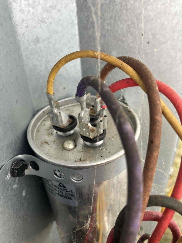 Responded to service call for AC unit producing loud humming noise before starting. Diagnosed failed capacitor causing hard start condition. Removed defective capacitor and installed new replacement unit, restoring proper system operation. Tested unit through full cooling cycle to verify normal startup and operation with no abnormal sounds.