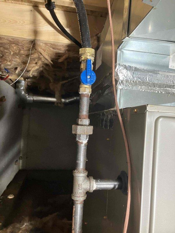Installed LP gas piping to connect tankless water heater located in exterior insulated building. Ran new gas line from existing supply point near furnace approximately 5 feet to outdoor on-demand water heater, including necessary fittings, shut-off valve, and flexible connectors. Previous installer had completed water heater installation but was unable to complete gas line connection, requiring our gas piping expertise to finalize the installation and make unit operational.