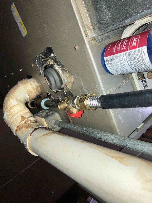 Installed new gas piping with flare fittings and brass shut-off valve with red handle in utility space. Completed professional installation with proper compression fittings and secure mounting to ensure safe gas line operation.