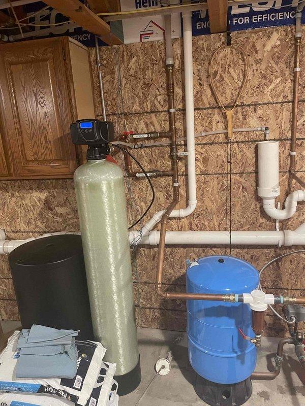 Completed annual preventive maintenance on water conditioning system. Performed water quality testing before and after system operation, confirming proper functioning of water softener equipment with green fiberglass tank and digital control head. Inspected all plumbing connections, copper piping, valves, and pressure tank components to ensure system integrity and optimal performance.
