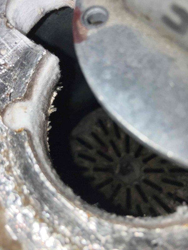Responded to no heat and no hot water complaint on 99COD combi boiler. Upon inspection, confirmed failed heat exchanger showing significant corrosion and deterioration on mounting components and internal assemblies. Blower assembly also failed and non-operational. Extensive rust damage observed throughout critical components including metal flanges and connection points, indicating advanced system deterioration. Evaluated system for potential repair versus replacement. Due to severity of heat exchanger failure, extent of corrosion damage, and failed blower motor, determined unit was beyond economical repair. Provided second opinion confirming replacement recommendation. Documented equipment condition with photos showing corroded mounting hardware, deteriorated internal components, and failed blower assembly. Installed new replacement boiler unit to restore heating and domestic hot water service.