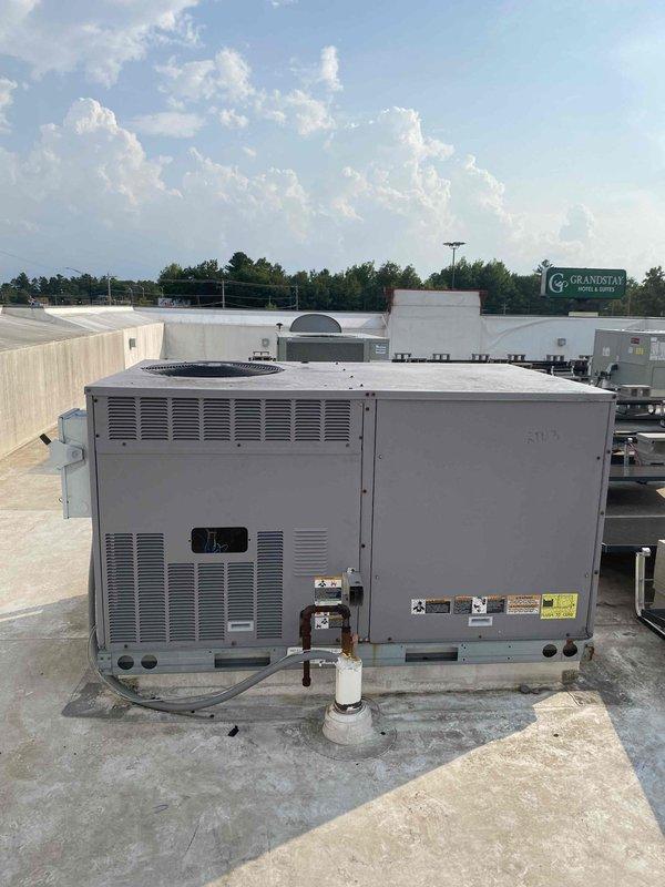 Responded to no cooling complaint with reports of incorrect temperature readings across multiple zones. Upon inspection, discovered seized condenser fan motor on rooftop package unit showing extensive rust and corrosion. Ordered replacement motor for installation. Zone sensor reprogramming will be addressed during motor replacement visit to resolve thermostat discrepancies showing 82°F on all displays while actual room temperatures varied significantly.