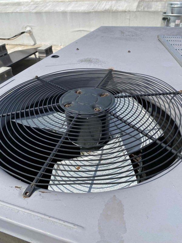Removed and replaced failed condenser fan motor on rooftop unit #3. Tested system operation and verified proper functionality of capacitor and fan assembly upon completion. Unit restored to normal operating condition with all components running within manufacturer specifications.